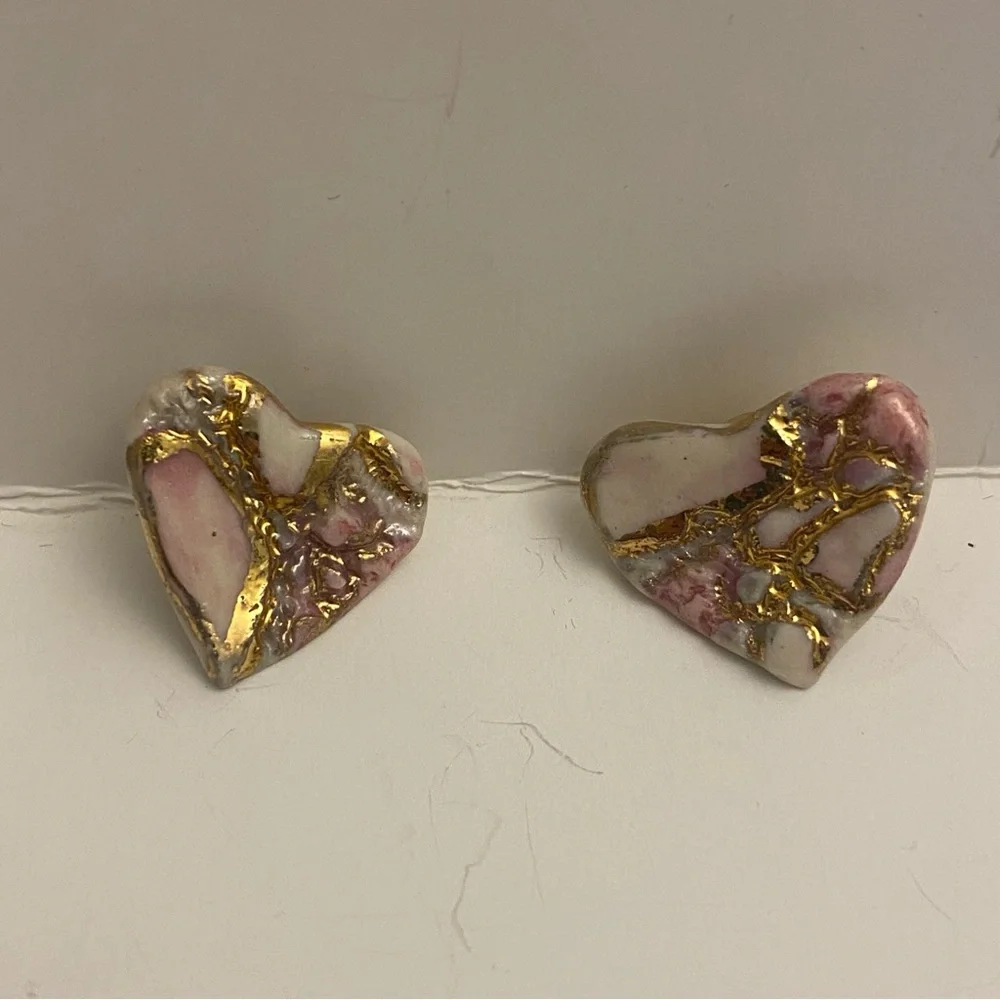 Two sets of heart earrings. Post earrings